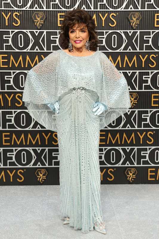 Joan Collins Stuns At 2023 Emmy Awards In Sparkling Blue Gown