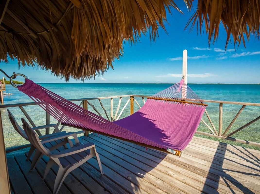 Exclusive Paradise Found: A Review Of Thatch Caye's Premier Overwater Bungalows In Belize