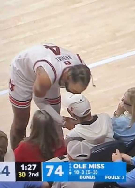 Morgan Freeman Grabs Auburn Player's Jersey At Basketball Game