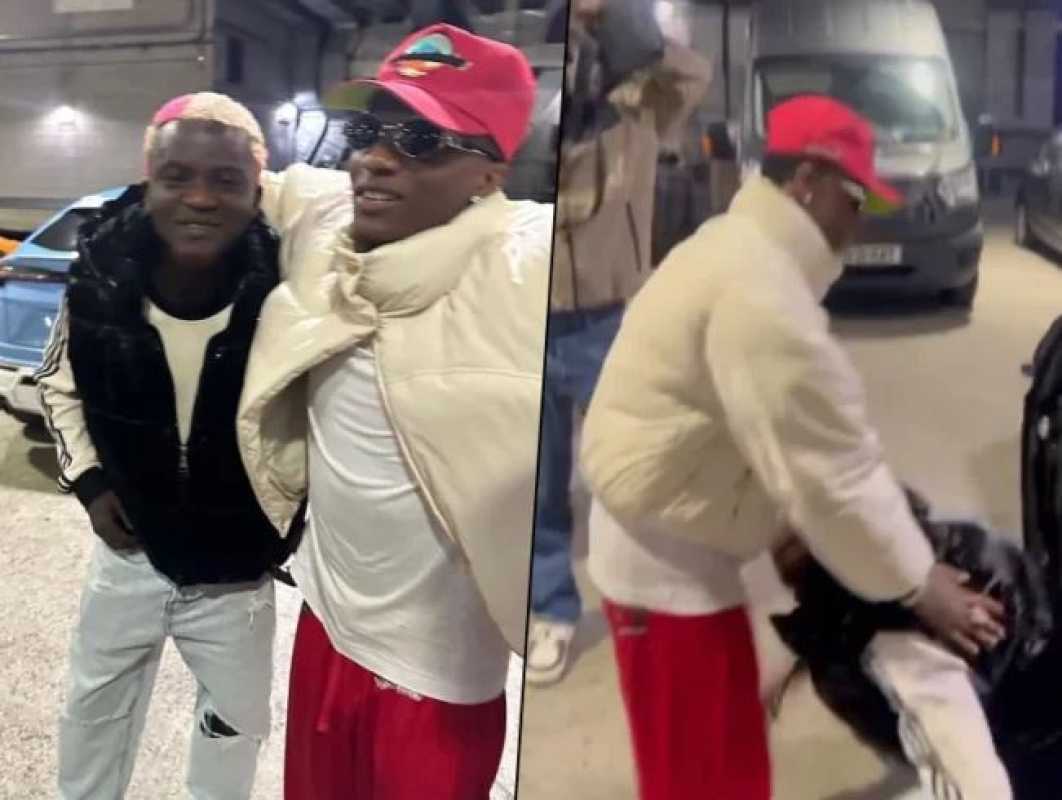 Street Artist Portable Prostrates To Greet Wizkid In London