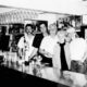 Bartender Serving Drinks In A University Pub