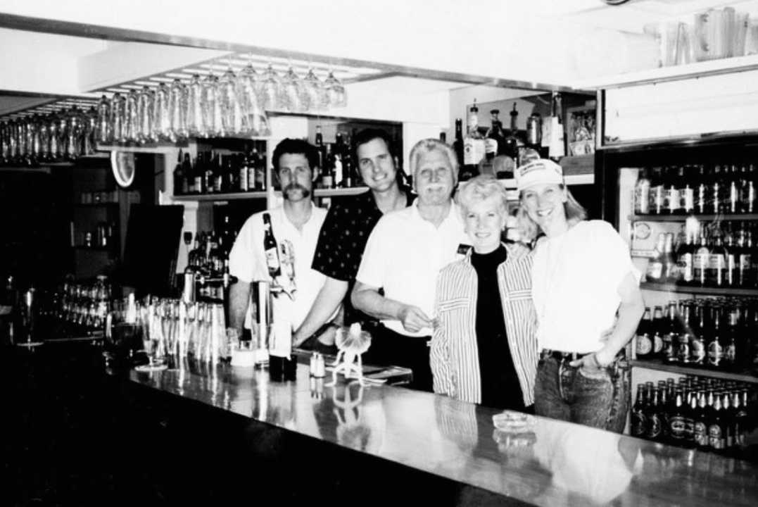 Bartender Serving Drinks In A University Pub