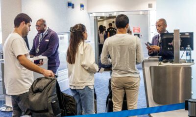 American Airlines Boarding Gate With Passengers And Alert System