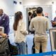 American Airlines Boarding Gate With Passengers And Alert System