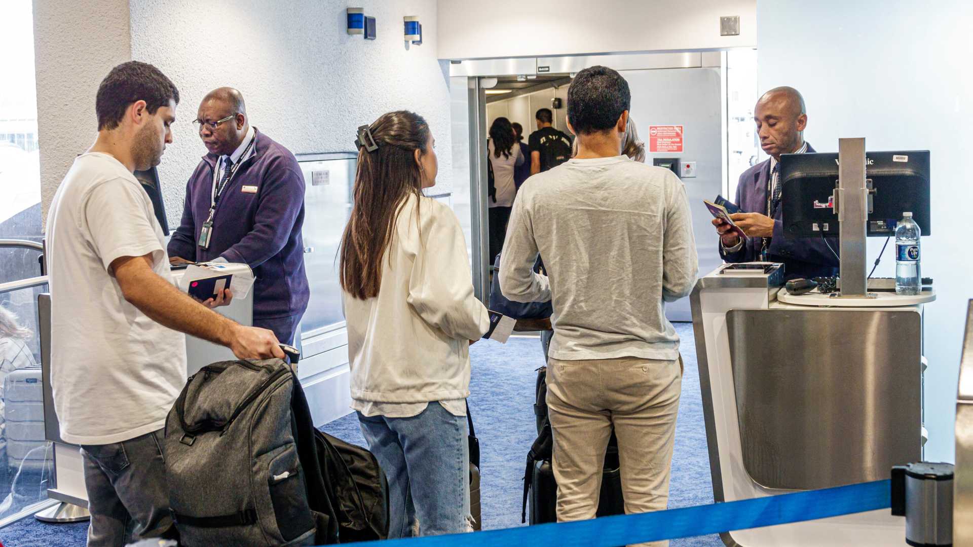 American Airlines Boarding Gate With Passengers And Alert System