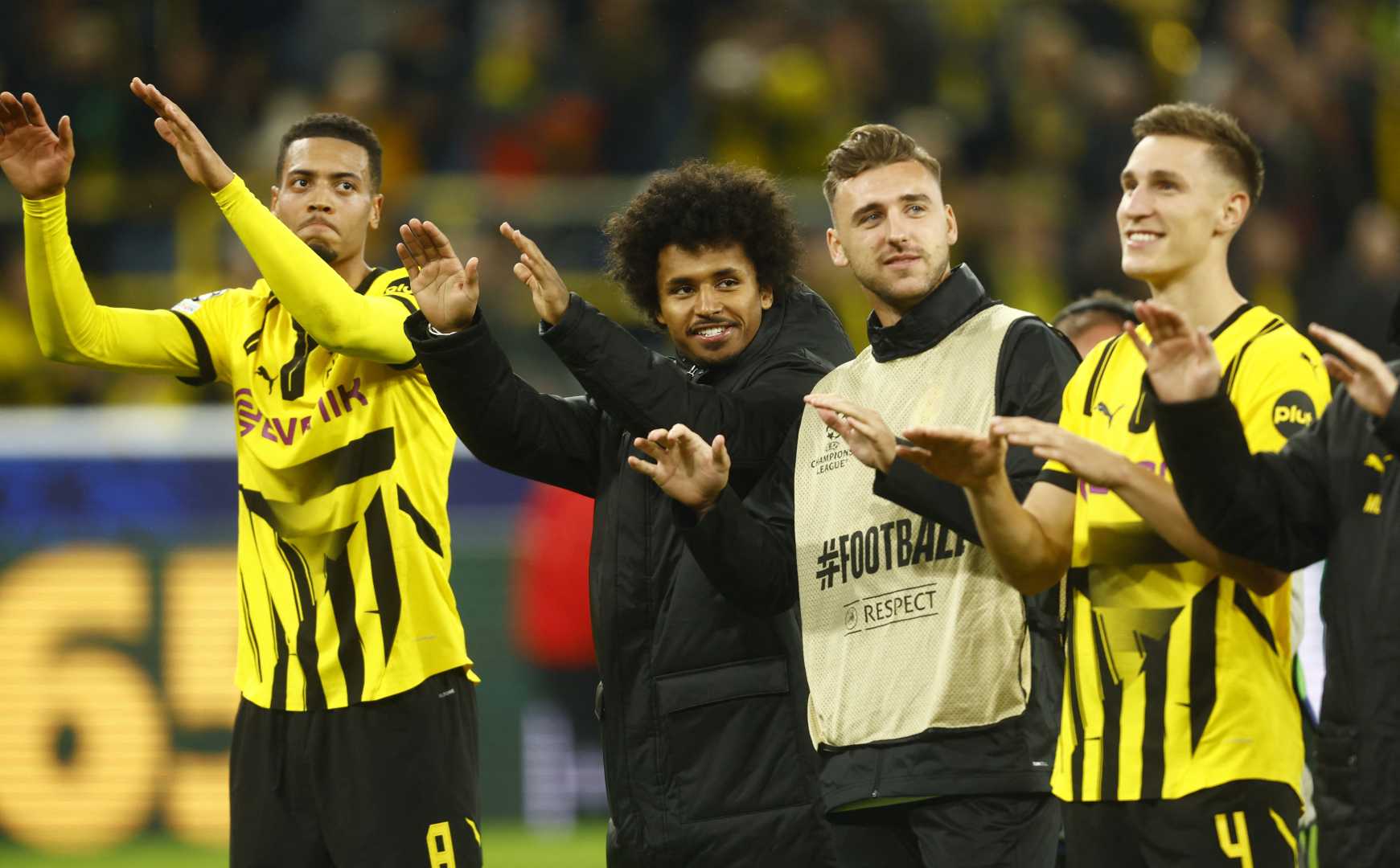 Borussia Dortmund Players Celebrating A Goal