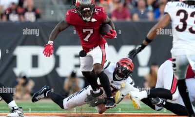 Bucky Irving Running With The Ball In An Nfl Game