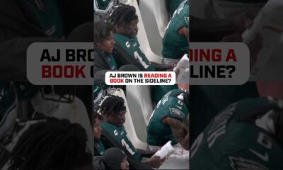 A.j. Brown Reading Book On Eagles Sideline