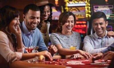 Carnival Cruise Line Game Room With Passengers Playing Cards