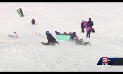 Children Sledding In Snow At Brookside Park