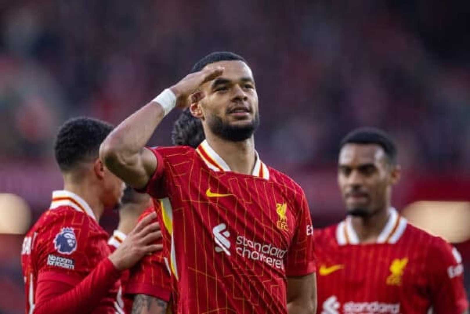 Liverpool Fc Players Celebrating A Goal At Anfield