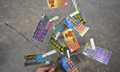 Lottery Tickets And Numbers On Table