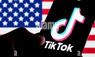 Tiktok App On Smartphone With U.s. Flag Background