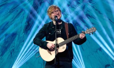 Ed Sheeran Performing On Stage With Guitar