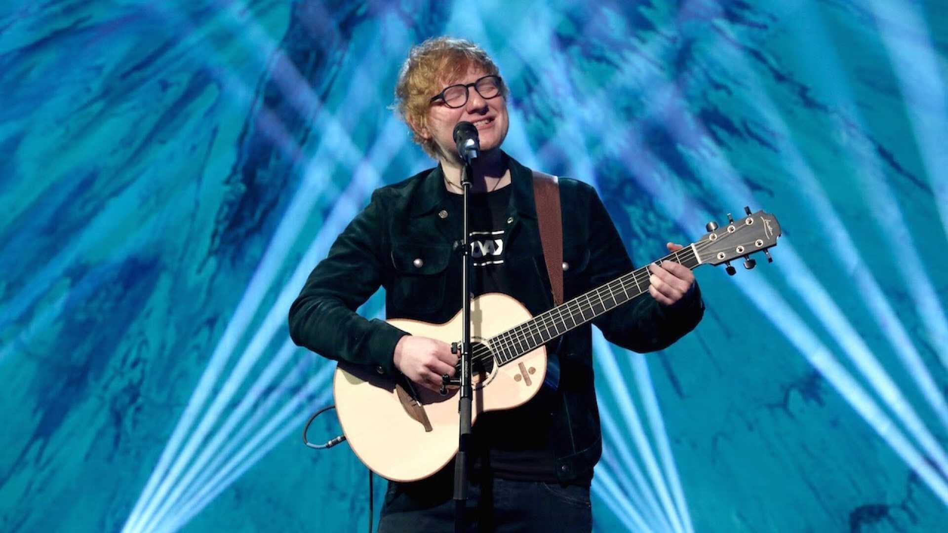 Ed Sheeran Performing On Stage With Guitar