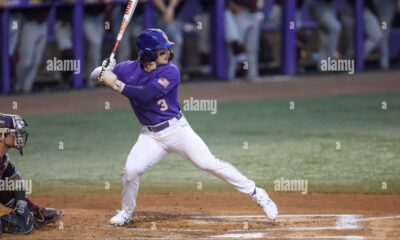 Lsu Baseball Players In Action At Alex Box Stadium