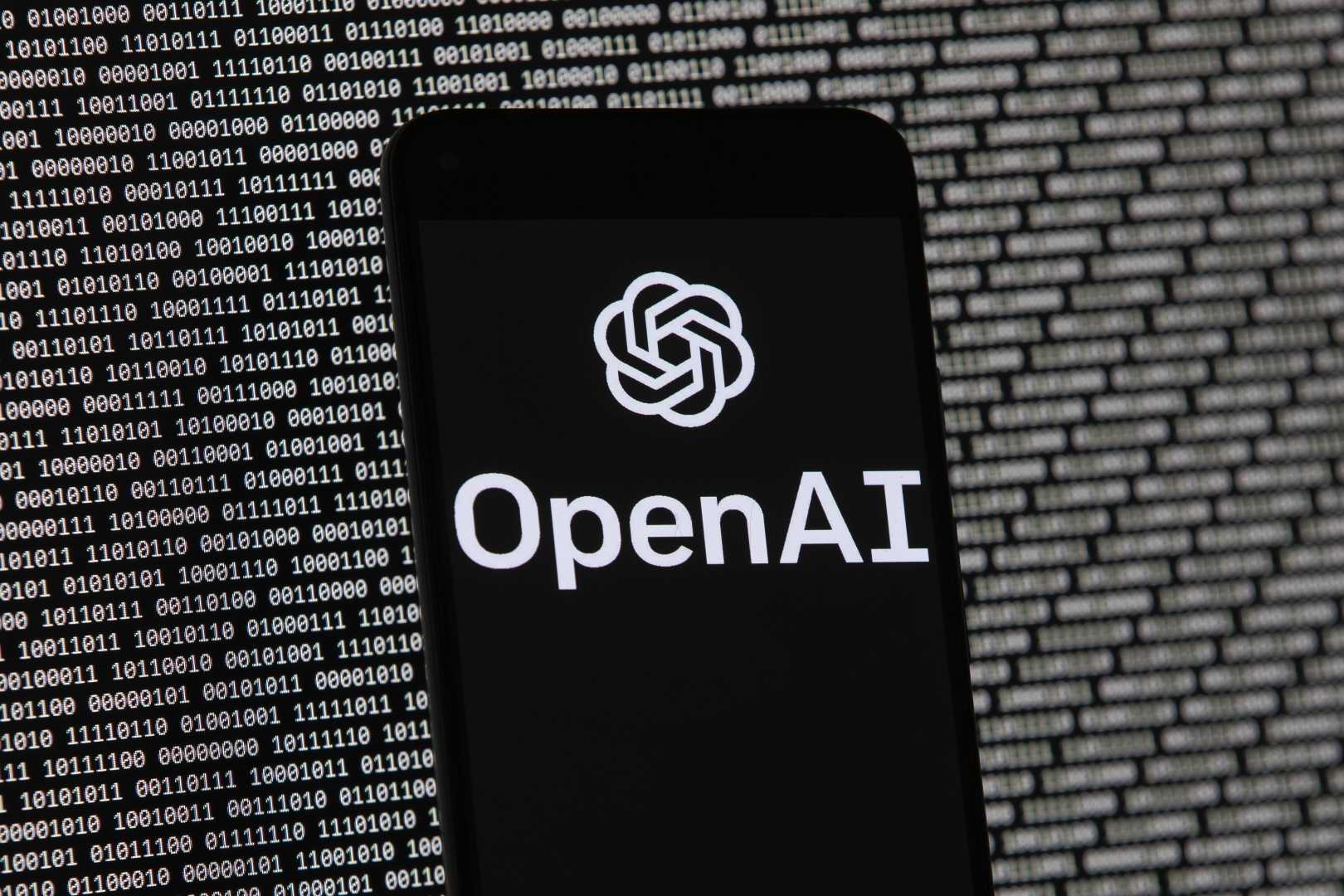 Openai Logo On Mobile With Binary Data Background