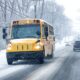 School Buses Driving In Snowy Roads