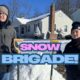 Two Teenage Volunteers Shoveling Snow In Seymour Connecticut