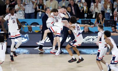 Uconn Basketball Team Celebrating On The Court