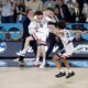 Uconn Basketball Team Celebrating On The Court