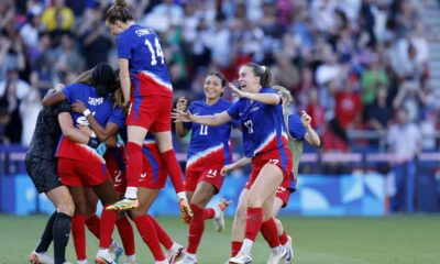 Uswnt Players Celebrating During A Match