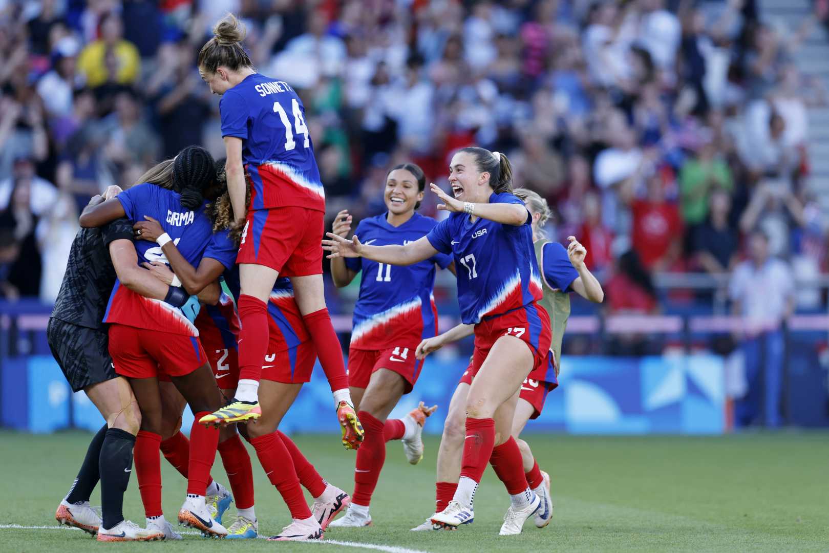 Uswnt Players Celebrating During A Match