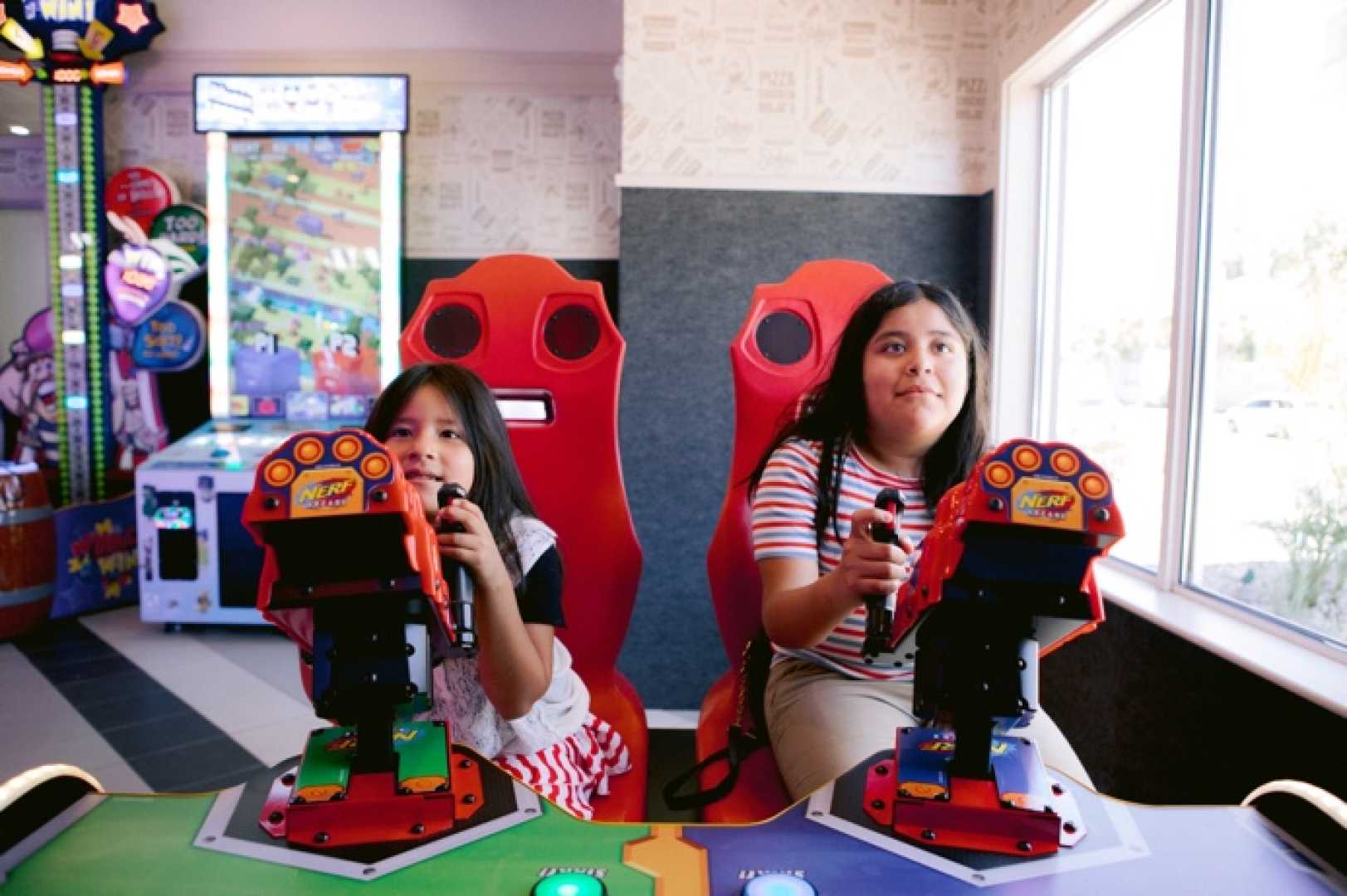 Children Playing In Restaurant Arcade Games