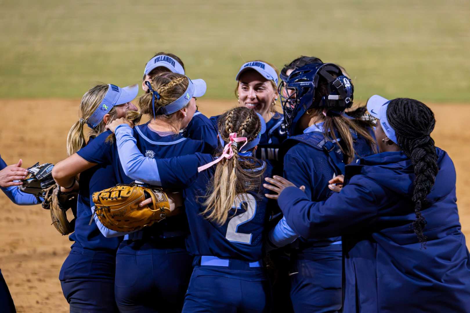 Creighton Softball Players Warming Up Before A Game