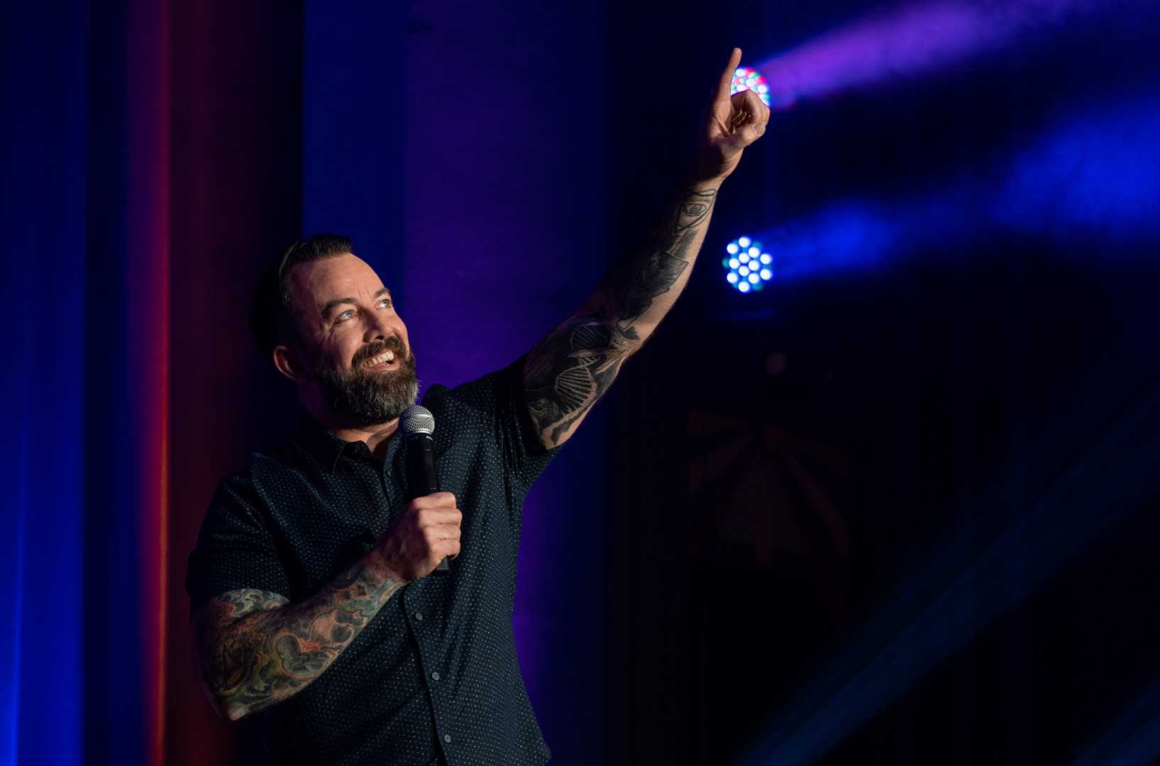 Dan Cummins Comedian Performing On Stage