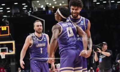 James Madison University Basketball Players Celebrating