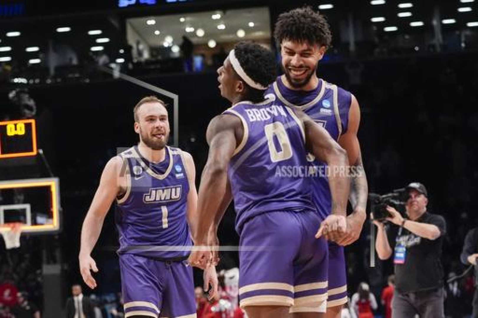 James Madison University Basketball Players Celebrating