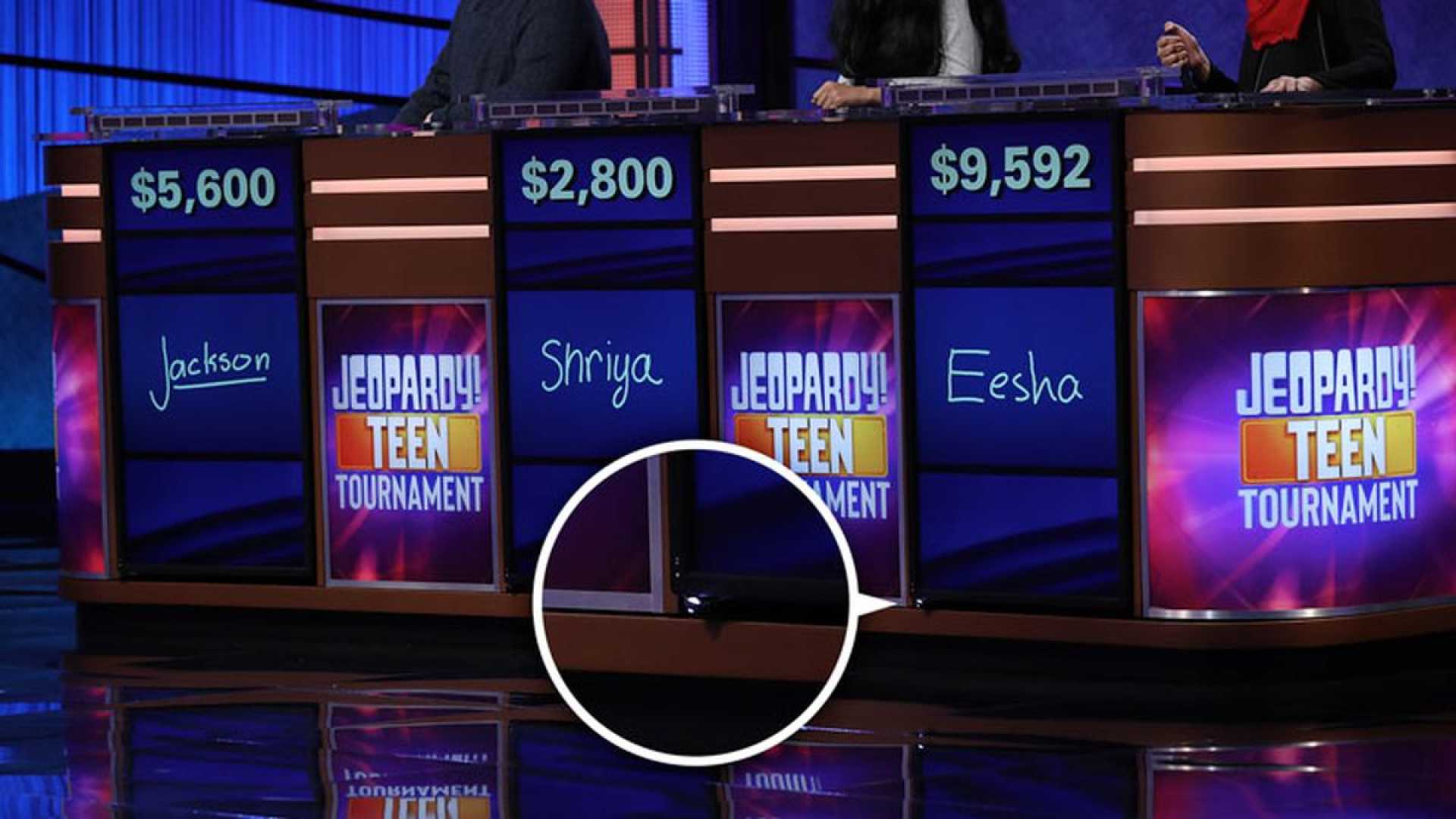 Jeopardy! Game Show Contestants At Podiums