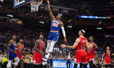 Jonathan Kuminga Dunking During A Basketball Game