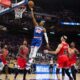 Jonathan Kuminga Dunking During A Basketball Game