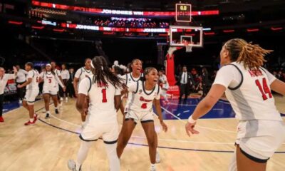 St. John's Basketball Team Celebrating Victory