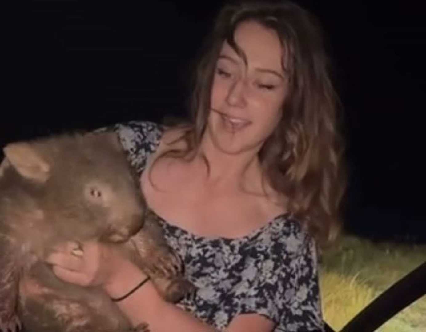 Woman Holding Baby Wombat Australia