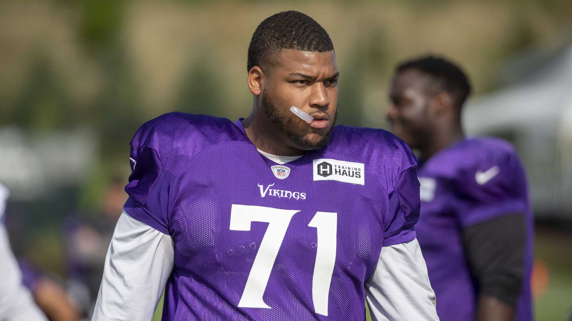 Christian Darrisaw And Harrison Smith Football Action